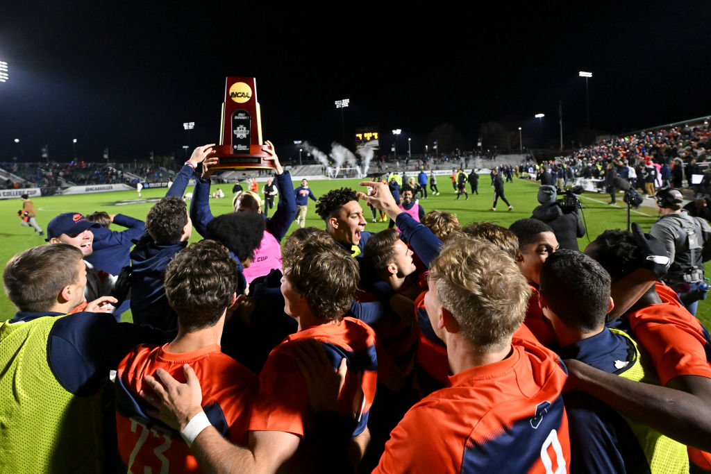 CARY, NORTH CAROLINA - DECEMBER 12: The Syracuse Orange celebrate after defeating the Indiana Hoosiers during the Division I Men’s Soccer Championship on December 12, 2022 in Cary, North Carolina.