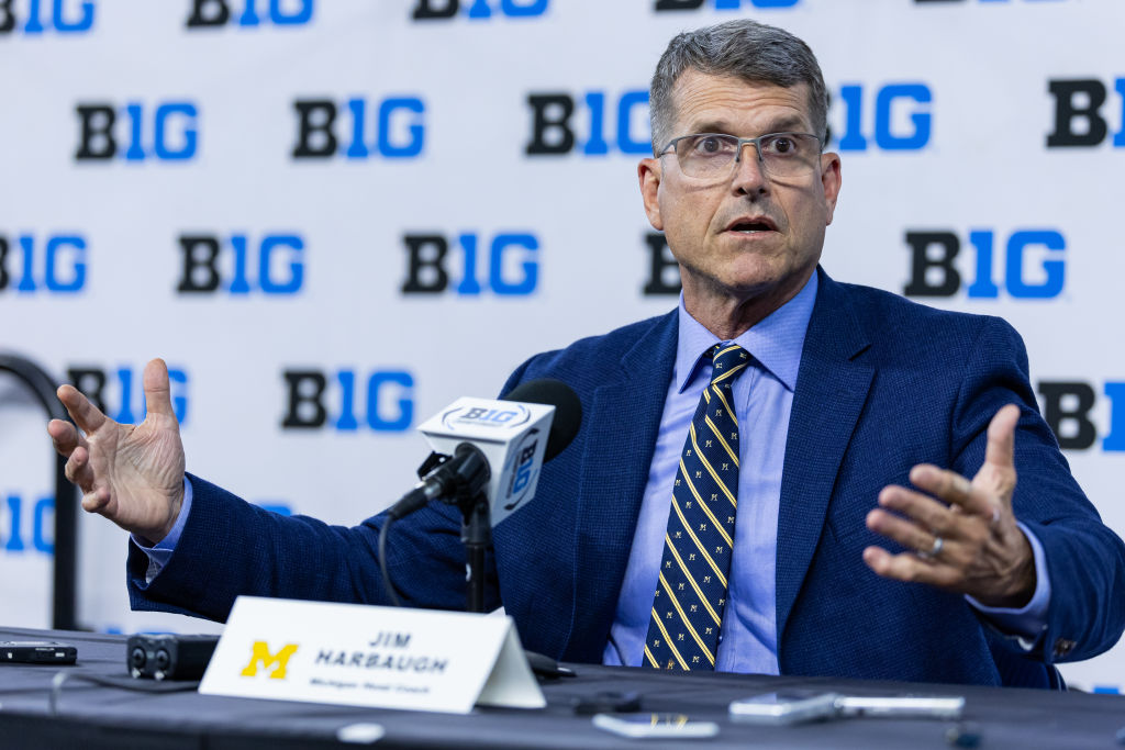 INDIANAPOLIS, INDIANA - JULY 27: Head coach Jim Harbaugh of the Michigan Wolverines speaks at Big Ten football media days at Lucas Oil Stadium on July 27, 2023 in Indianapolis, Indiana.