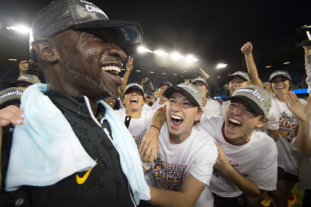 SAN JOSE, CA - DECEMBER 04: Head Coach Keidane McAlpine of the University of Southern California and his team celebrates after defeating West Virginia University during the Division I Women's Soccer Championship held at Avaya Stadium on December 04, 2016 in San Jose, California. USC defeated West Virginia 3-1 for the national title.