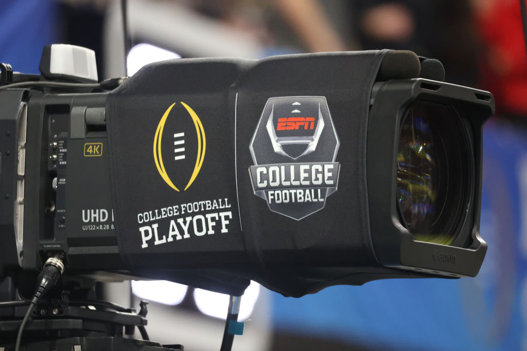 ATLANTA, GA - DECEMBER 31: A general view of a television camera with ESPN college football and college football playoff logos during the college football Playoff Semifinal game at the Chick-fil-a Peach Bowl between the Georgia Bulldogs and the Ohio State Buckeyes on December 31, 2022 at Mercedes-Benz Stadium in Atlanta, Georgia.